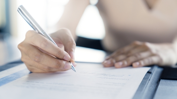 Patient Filling out insurance papers at Eastside Family Dental Care